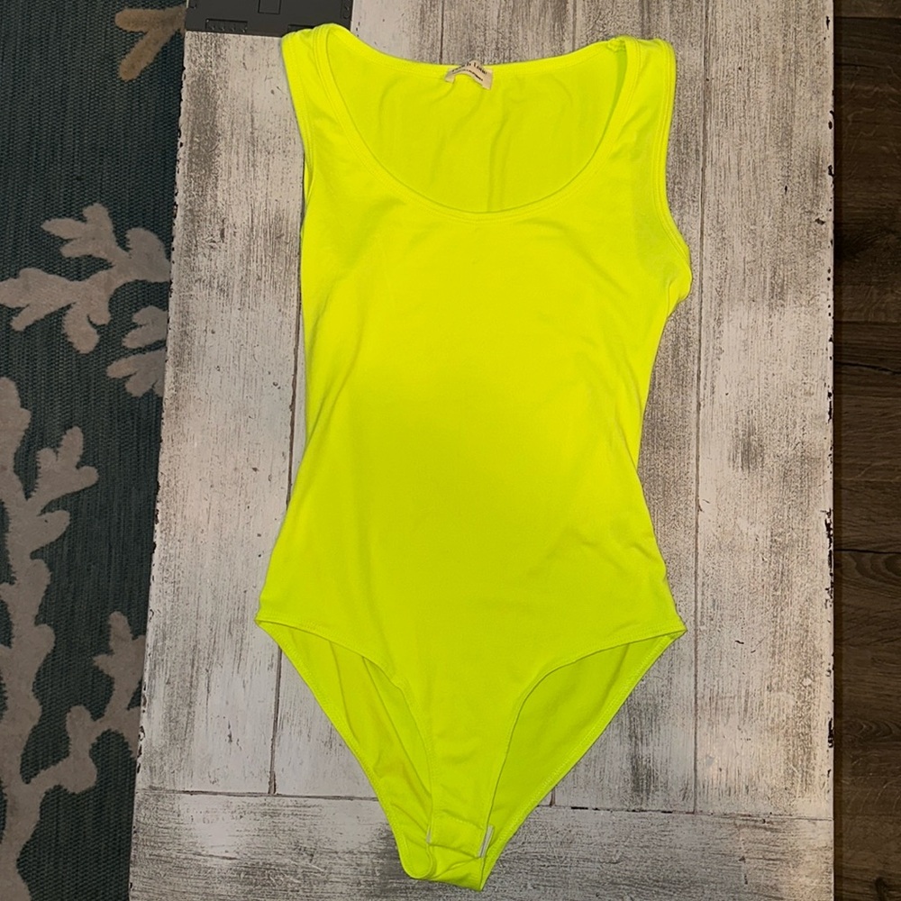 Lime green/yellow one size bodysuit. Never worn.